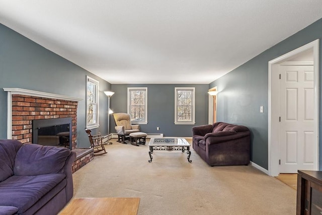 living room featuring a brick fireplace, a baseboard heating unit, baseboards, and carpet floors