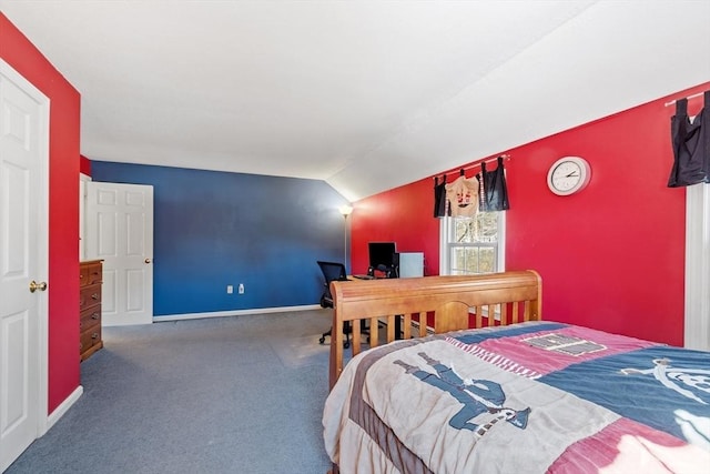 bedroom with baseboards, lofted ceiling, and carpet floors