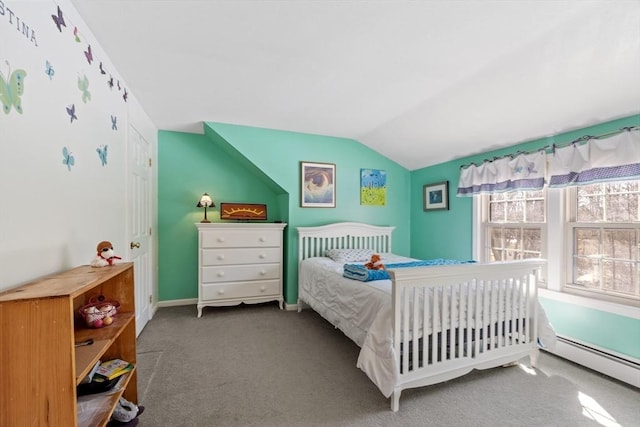 bedroom with a baseboard heating unit, baseboards, carpet flooring, and vaulted ceiling