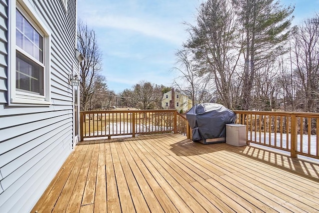 wooden deck with area for grilling