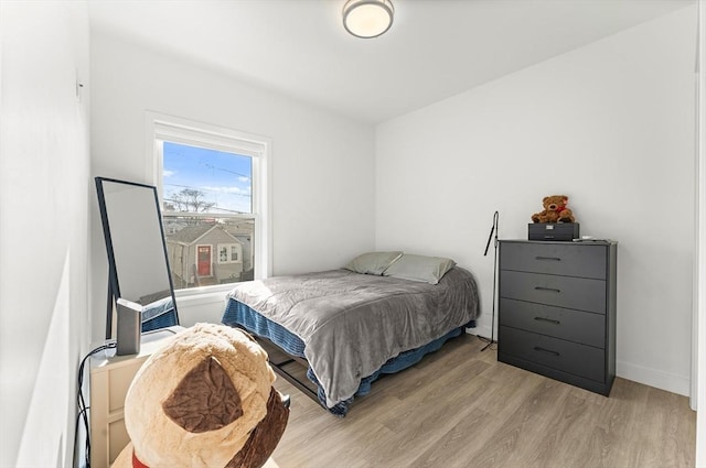 bedroom with light hardwood / wood-style flooring