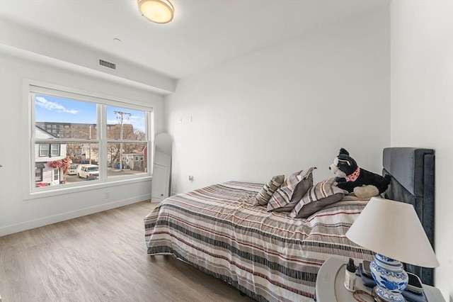 bedroom featuring hardwood / wood-style floors