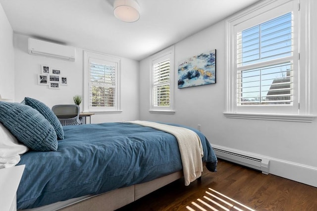 bedroom with wood finished floors, a baseboard radiator, and a wall mounted AC