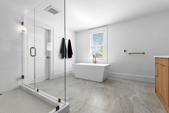 full bath featuring baseboards, visible vents, a shower stall, and a freestanding bath