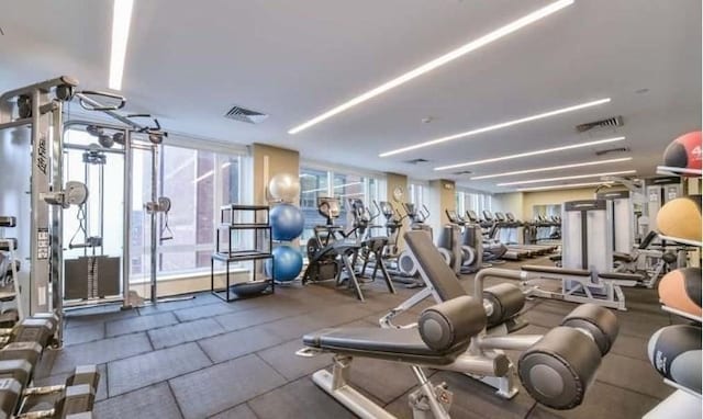 gym featuring visible vents and plenty of natural light