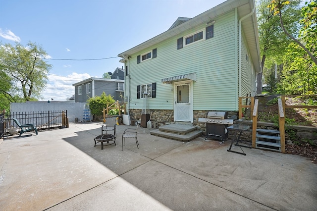 18 Gordon St, Worcester, MA 01604 - rear view of house featuring a fire pit and a patio