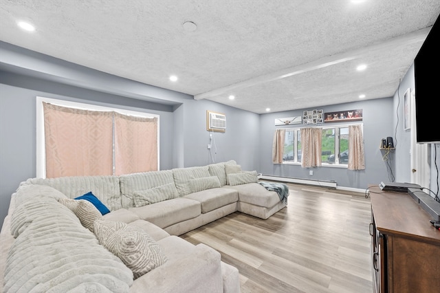 18 Gordon St, Worcester, MA 01604 - living area with a baseboard heating unit, recessed lighting, wood finished floors, a textured ceiling, and a wall mounted AC