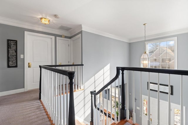 hallway featuring carpet floors and ornamental molding