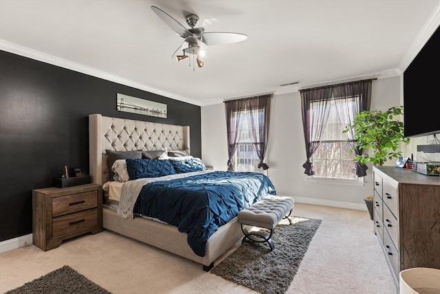 bedroom featuring ceiling fan, light colored carpet, and crown molding