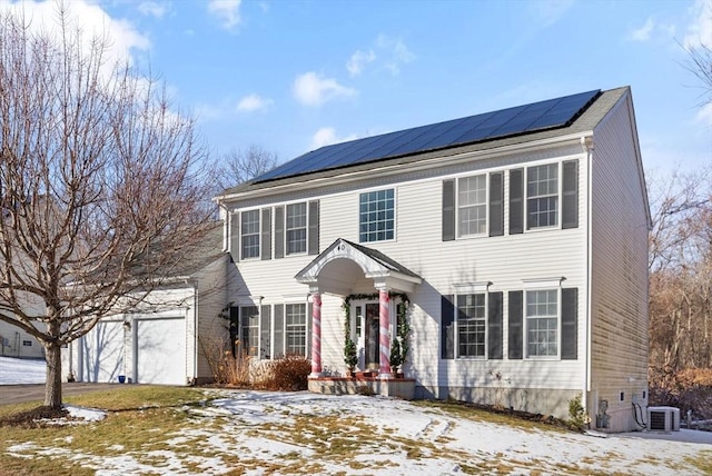 colonial house with solar panels and central AC unit