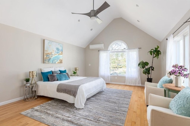 bedroom with ceiling fan, lofted ceiling, wood-type flooring, and an AC wall unit