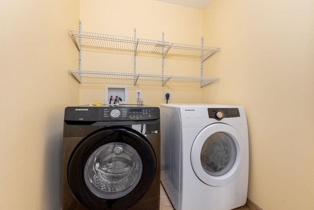 laundry room with independent washer and dryer