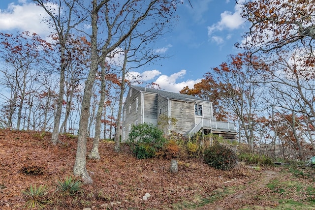 view of side of home featuring a deck