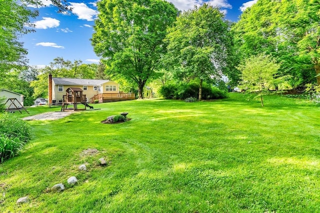 2 Walker St, Norton, MA 02766 - view of grassy yard featuring a deck and stairs
