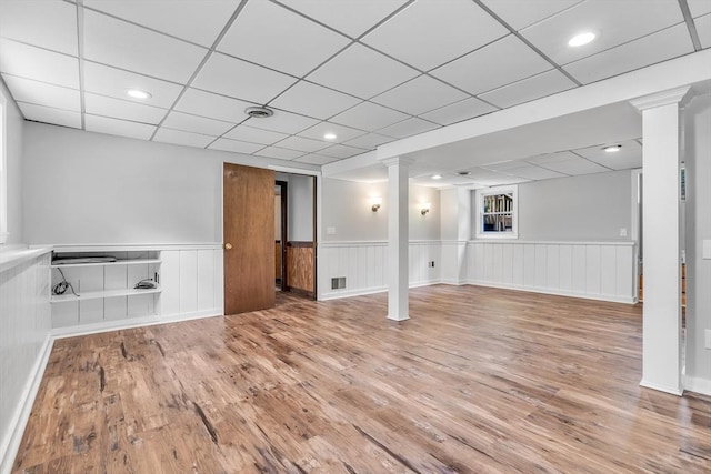 2 Walker St, Norton, MA 02766 - below grade area featuring wood finished floors, a wainscoted wall, and a drop ceiling