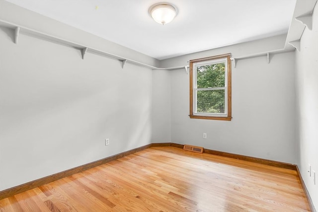 2 Walker St, Norton, MA 02766 - empty room with light wood-type flooring and baseboards