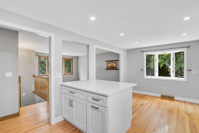 2 Walker St, Norton, MA 02766 - kitchen with light countertops, white cabinets, recessed lighting, light wood-style floors, and baseboards