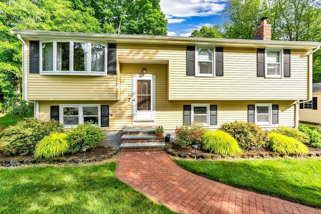 2 Walker St, Norton, MA 02766 - raised ranch featuring a chimney and a front yard