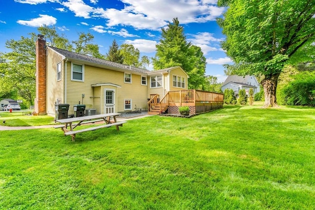 2 Walker St, Norton, MA 02766 - rear view of property with a chimney, a deck, a lawn, and central air condition unit