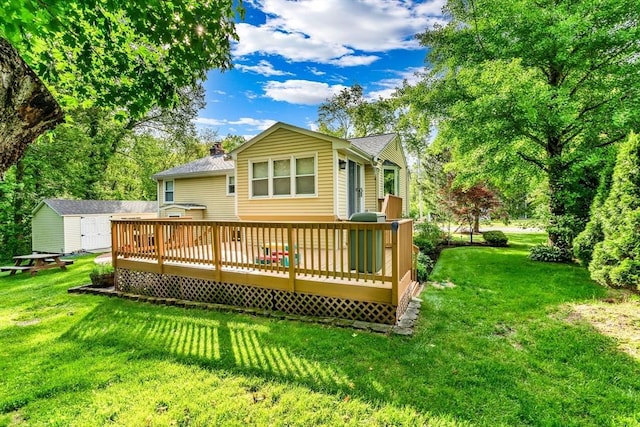 2 Walker St, Norton, MA 02766 - back of house with a wooden deck, a lawn, and a chimney