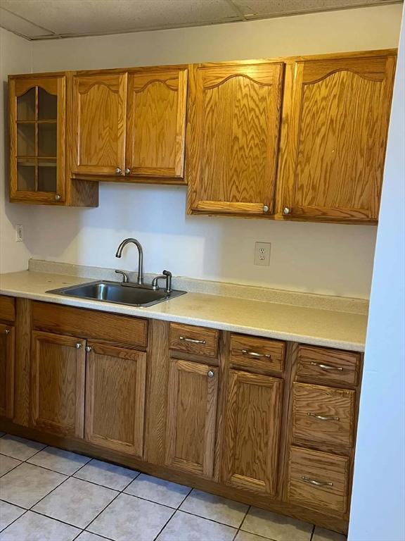 kitchen with sink and light tile patterned floors