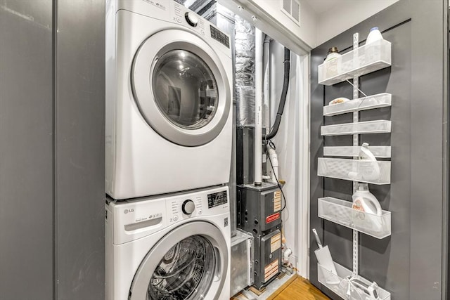 531-533 E 2nd St Unit 202, Boston, MA 02127 - laundry area featuring stacked washer / drying machine and light wood finished floors
