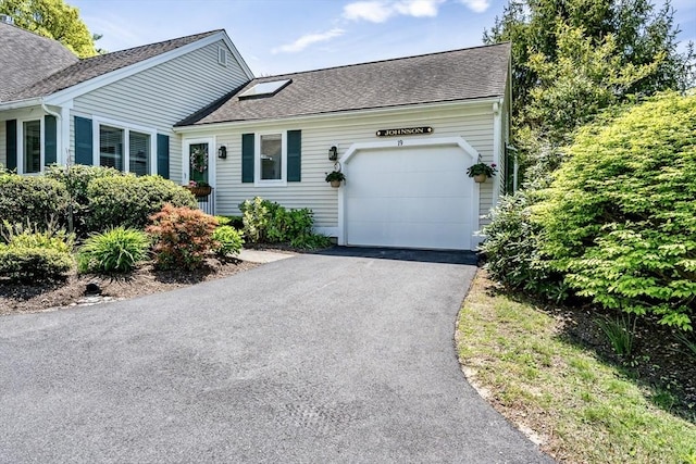 19 Longwood Rd Unit 243, Mashpee, MA 02649 - view of front of property featuring a shingled roof, an attached garage, and asphalt driveway