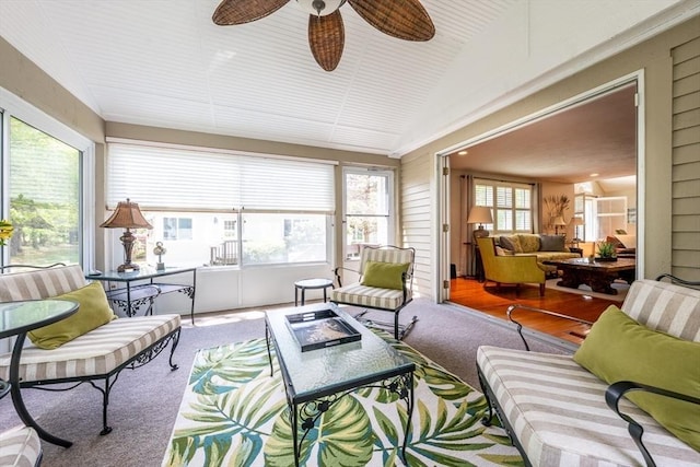 19 Longwood Rd Unit 243, Mashpee, MA 02649 - sunroom with carpet, an outdoor living space with a fire pit, lofted ceiling, and ceiling fan
