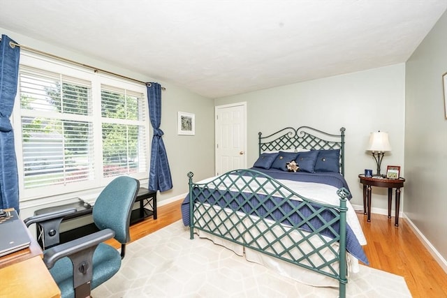 19 Longwood Rd Unit 243, Mashpee, MA 02649 - bedroom featuring light wood-style flooring, a desk, and baseboards