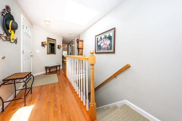 19 Longwood Rd Unit 243, Mashpee, MA 02649 - hallway with an upstairs landing, light wood-type flooring, and baseboards