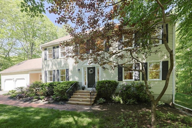 13 Valleywood Rd, Hopkinton, MA 01748 - colonial inspired home featuring a garage