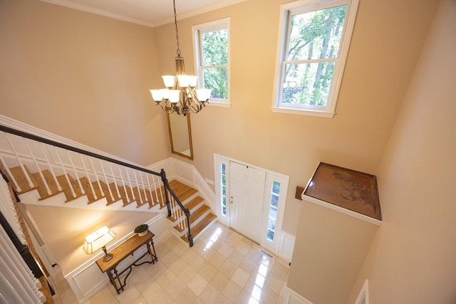 13 Valleywood Rd, Hopkinton, MA 01748 - foyer with stairs, light tile patterned floors, a chandelier, baseboards, and ornamental molding