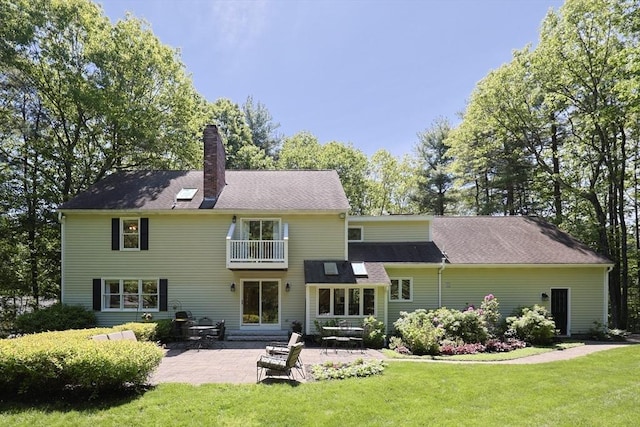 13 Valleywood Rd, Hopkinton, MA 01748 - back of house featuring a yard, a balcony, a chimney, and a patio