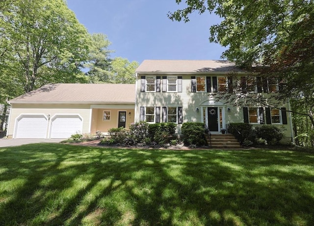 13 Valleywood Rd, Hopkinton, MA 01748 - colonial home featuring an attached garage, a front yard, and driveway