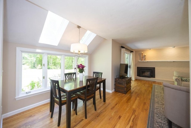 13 Valleywood Rd, Hopkinton, MA 01748 - dining room with a skylight, baseboards, lofted ceiling, and healthy amount of natural light