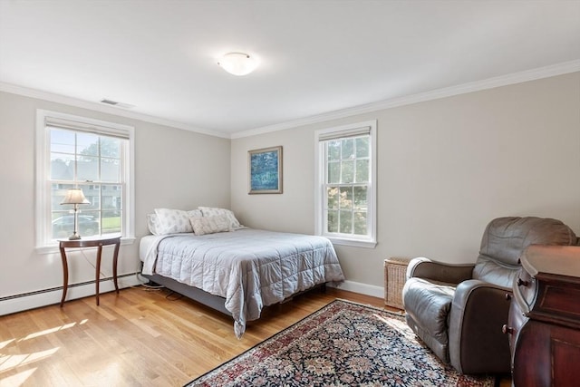 9 New Meadow Rd, Lynnfield, MA 01940 - bedroom with light wood finished floors, crown molding, and a baseboard radiator