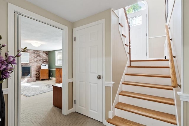 9 New Meadow Rd, Lynnfield, MA 01940 - staircase with carpet, baseboard heating, and a fireplace