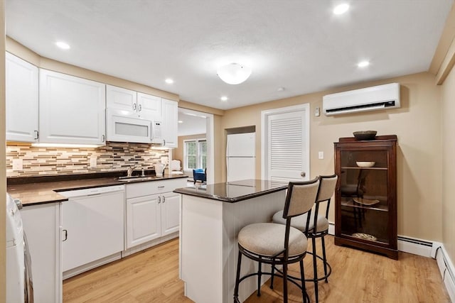9 New Meadow Rd, Lynnfield, MA 01940 - kitchen featuring white appliances, a wall mounted AC, light wood finished floors, white cabinetry, and recessed lighting