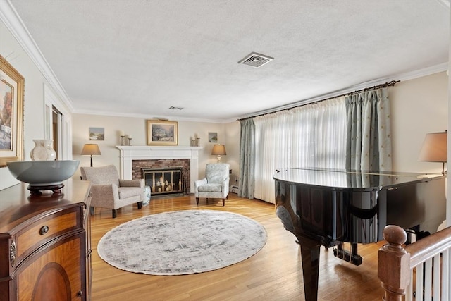 9 New Meadow Rd, Lynnfield, MA 01940 - living area featuring wood finished floors, a brick fireplace, and crown molding