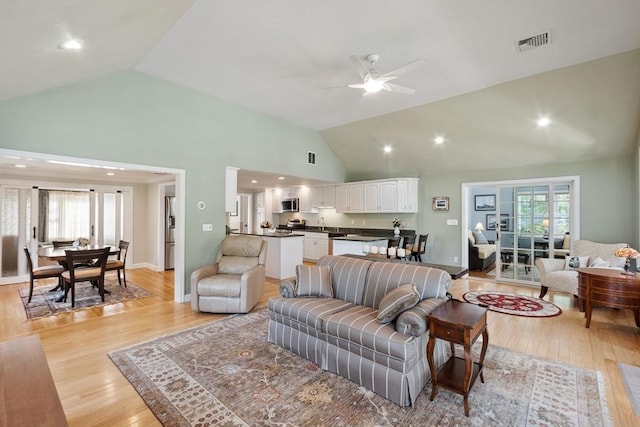 9 New Meadow Rd, Lynnfield, MA 01940 - living room with a ceiling fan, light wood-style flooring, healthy amount of natural light, and high vaulted ceiling
