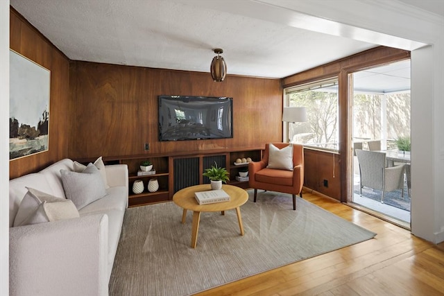 159 Payson Rd, Brookline, MA 02467 - living area featuring wood walls and wood finished floors
