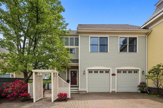 1488 Washington St Unit 1488, Newton, MA 02465 - view of front of home featuring decorative driveway and a garage