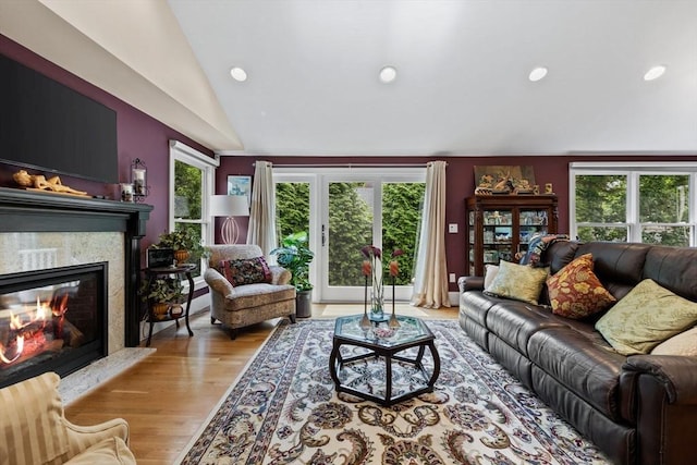 1488 Washington St Unit 1488, Newton, MA 02465 - living area featuring vaulted ceiling, a premium fireplace, wood finished floors, and recessed lighting