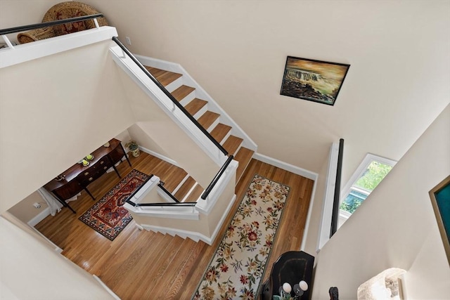 1488 Washington St Unit 1488, Newton, MA 02465 - stairs featuring wood finished floors and a high ceiling
