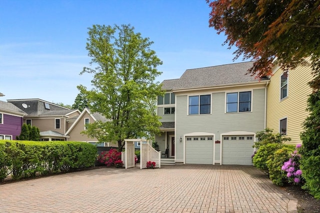 1488 Washington St Unit 1488, Newton, MA 02465 - view of front of house featuring decorative driveway and an attached garage