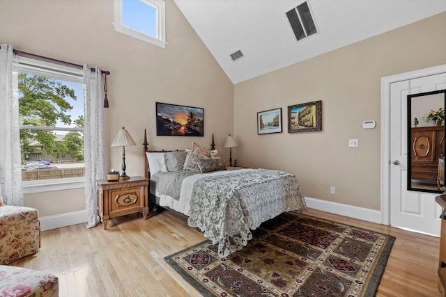 1488 Washington St Unit 1488, Newton, MA 02465 - bedroom with high vaulted ceiling, light wood-style flooring, and baseboards