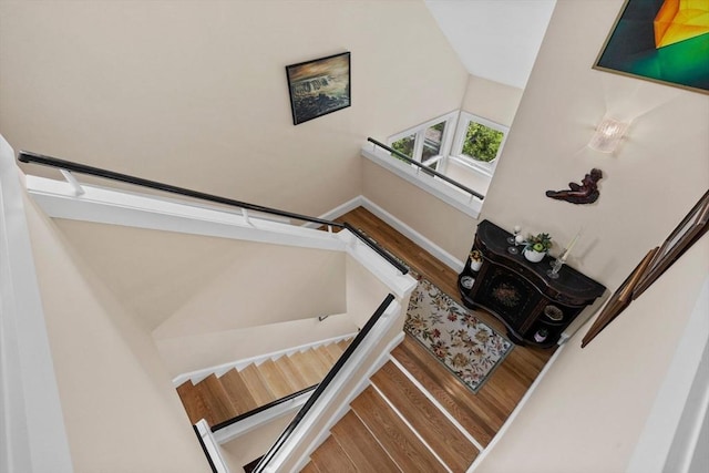 1488 Washington St Unit 1488, Newton, MA 02465 - stairway featuring wood finished floors and baseboards
