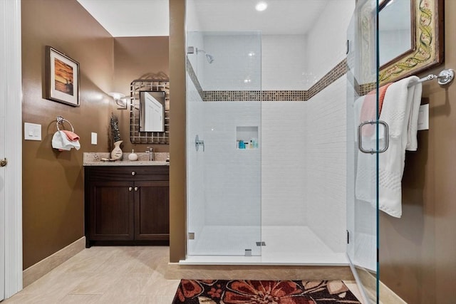 1488 Washington St Unit 1488, Newton, MA 02465 - full bath with a shower stall, vanity, and baseboards