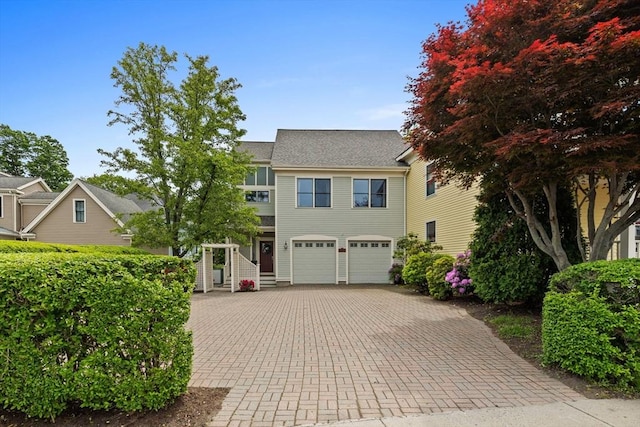 1488 Washington St Unit 1488, Newton, MA 02465 - view of front of property with decorative driveway and a garage