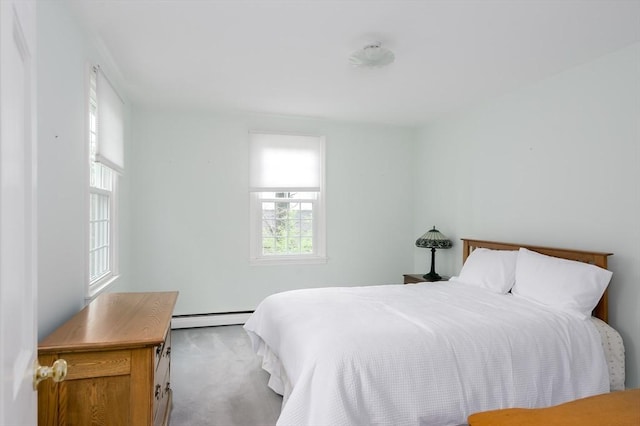 carpeted bedroom with baseboard heating